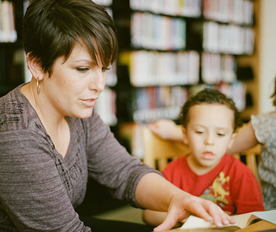 A female teacher with a male student